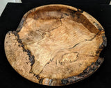 Maple burl natural edge hand-turned bowl.